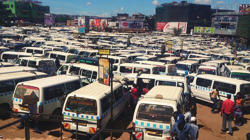 High angle view of vehicles on road along buildings