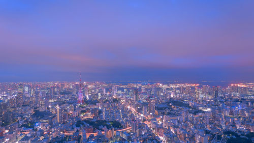 Aerial view of illuminated city at night