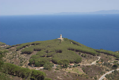 Scenic view of sea and mountains against sky