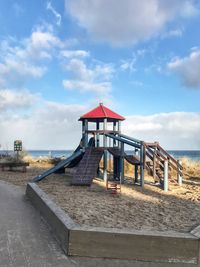 Built structure on beach against sky