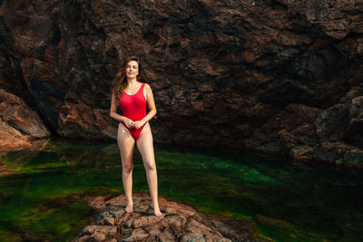 Woman standing on rock