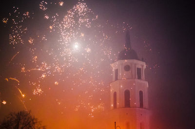 Low angle view of illuminated church against sky at night