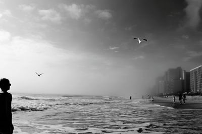 People flying over sea