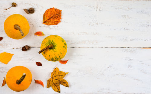 High angle view of orange leaves on table