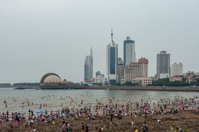 Group of people in city at waterfront