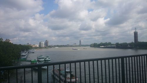 Cityscape against cloudy sky