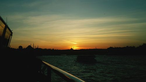 Scenic view of river at sunset