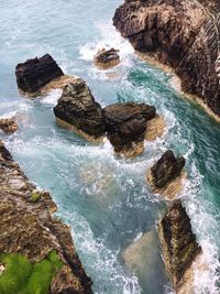 High angle view of rock formations in sea