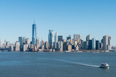 View of buildings in financial district at waterfront