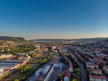 High angle view of townscape against clear blue sky