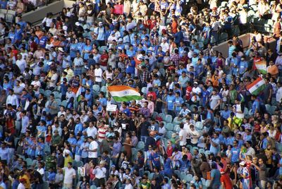 High angle view of spectators at stadium with indian flags