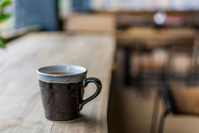 Close-up of coffee cup on table