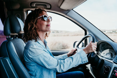 Woman sitting in car