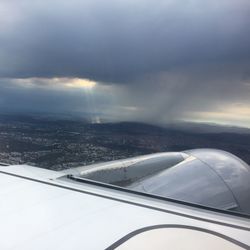 Airplane wing against sky