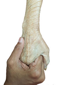 Close-up of human hand against white background