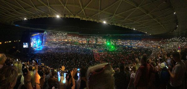 Panoramic view of crowd at music concert