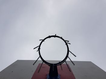 Low angle view of basketball hoop against sky