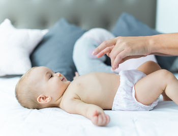 Cute baby lying on bed