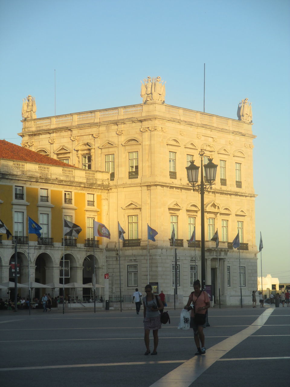 PEOPLE ON BUILDING IN CITY