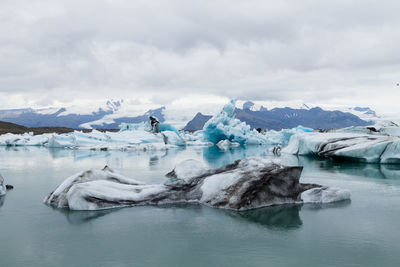 Scenic view of frozen lake against sky