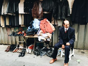 Man sitting in front of building