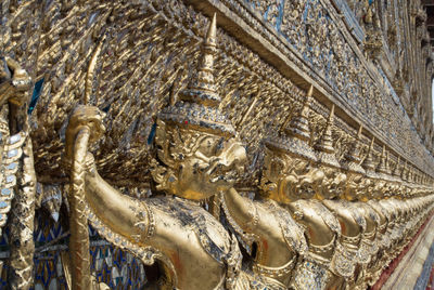 Close-up of golden statues