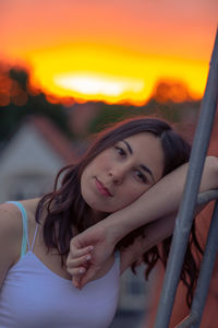 Portrait of beautiful young woman during sunset