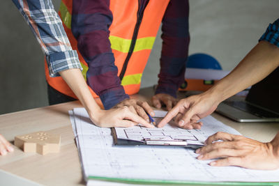 Low section of people working on table