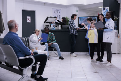 Low angle view of business colleagues working at airport