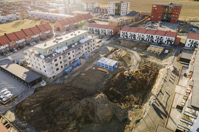 Aerial view of residential houses around construction site