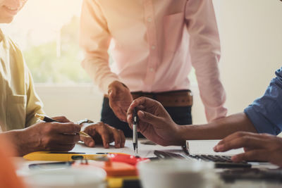 Businessmen working at desk in office