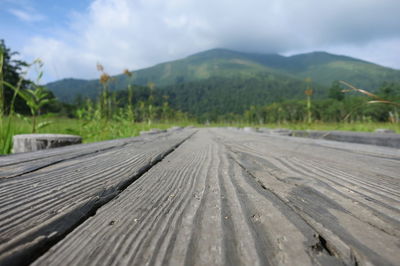 Surface level of empty road against sky