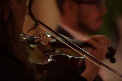 Close-up of man playing violin