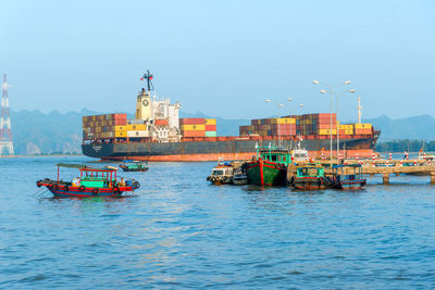 Ship sailing in sea against clear sky