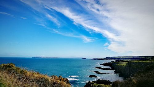 Scenic view of sea against blue sky