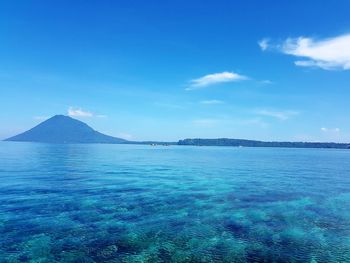 Scenic view of sea against blue sky