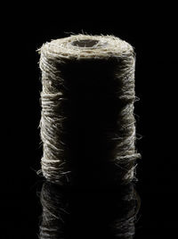 Close-up of rope against black background