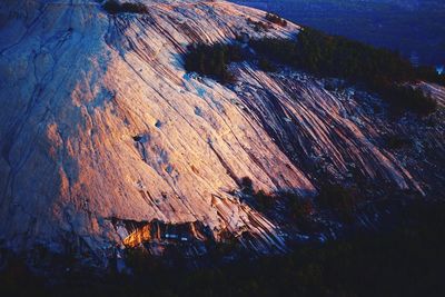 Close-up of illuminated water against sky at sunset