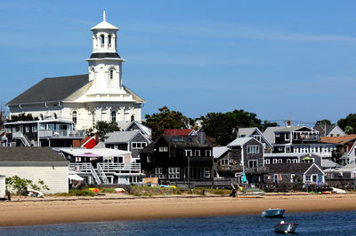 Houses on beach against sky