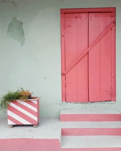 Red closed door of building