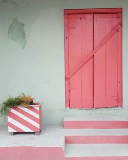 Red closed door of building