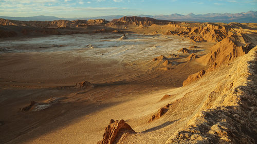 View of desert against cloudy sky