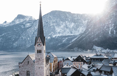 Panoramic view of buildings and mountains against sky