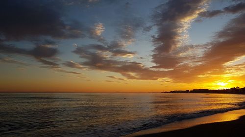 Scenic view of sea against sky during sunset