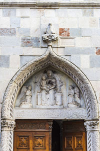 Low angle view of statue against building