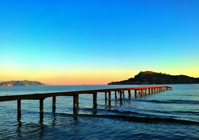 Pier on sea against sky