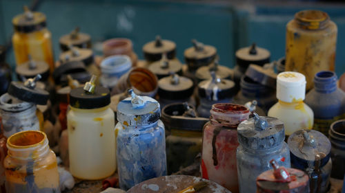 Close-up of bottles on table at market stall