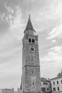 Low angle view of bell tower against sky