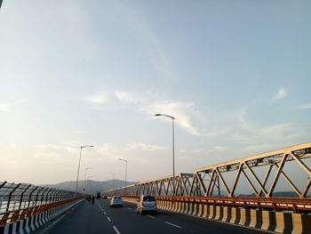 Bridge over road against sky