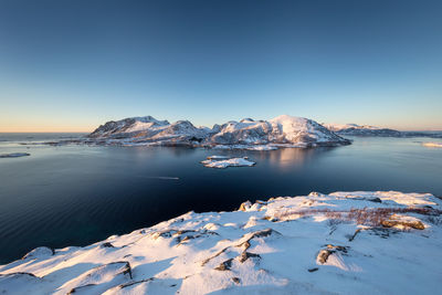 Scenic view of sea against sky during winter